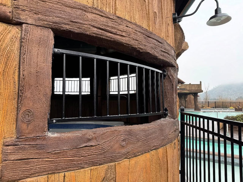 Black metal window grill on a resort tower