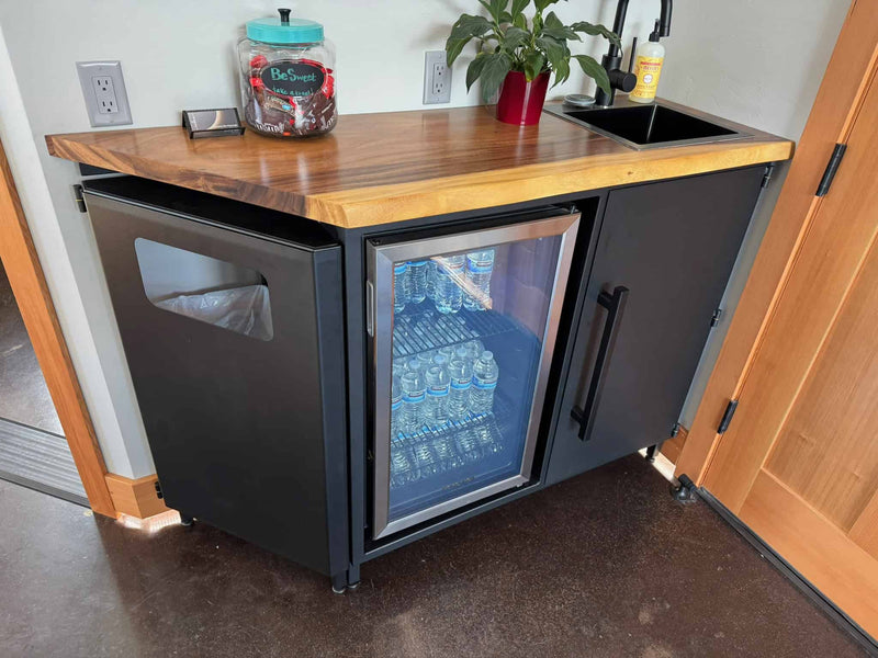 Custom metal multi use cabinet for drinks, trash, and storage in a small business located in roseburg Oregon.