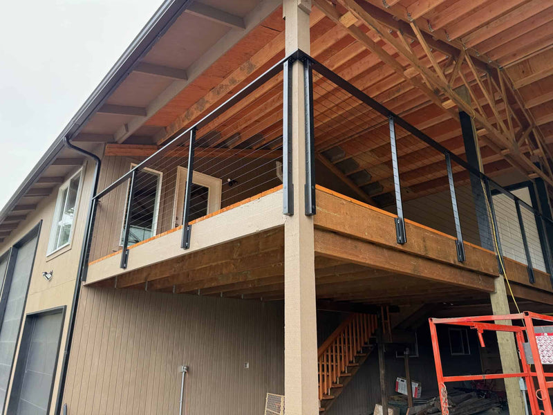 Black Steel and Wire railings on wood deck.