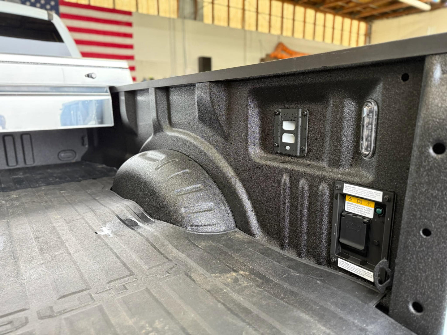 Removable factory rear-right tie-down bracket on Ford truck