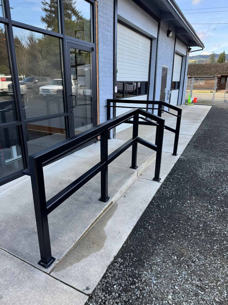 Custom metal heavy Duty Guard and Hand Rails in front of small business