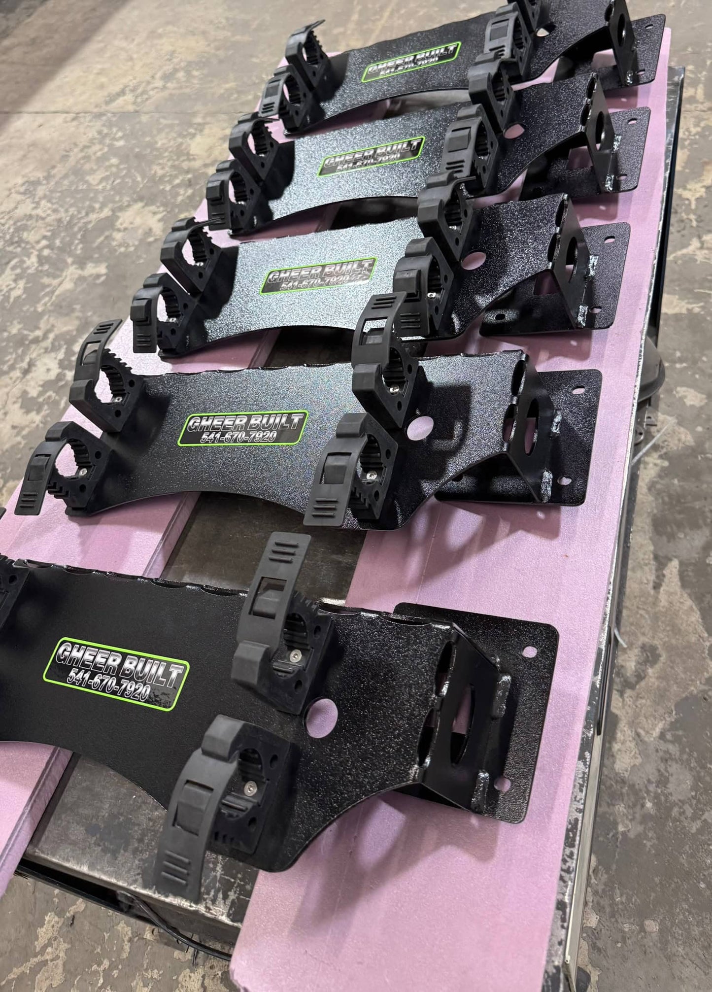 Row of heavy duty steel tool holders in a metal fab shop.