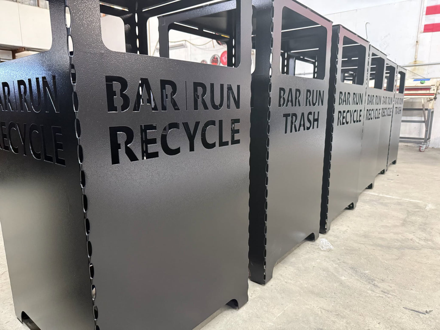 metal custom recycling bin in metal fab shop.