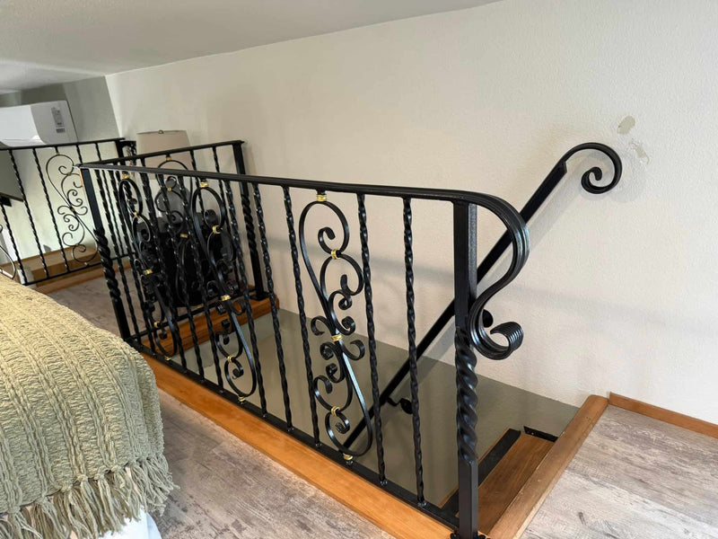Handrail, railing, and baluster custom metal artwork overlooking home stairs.