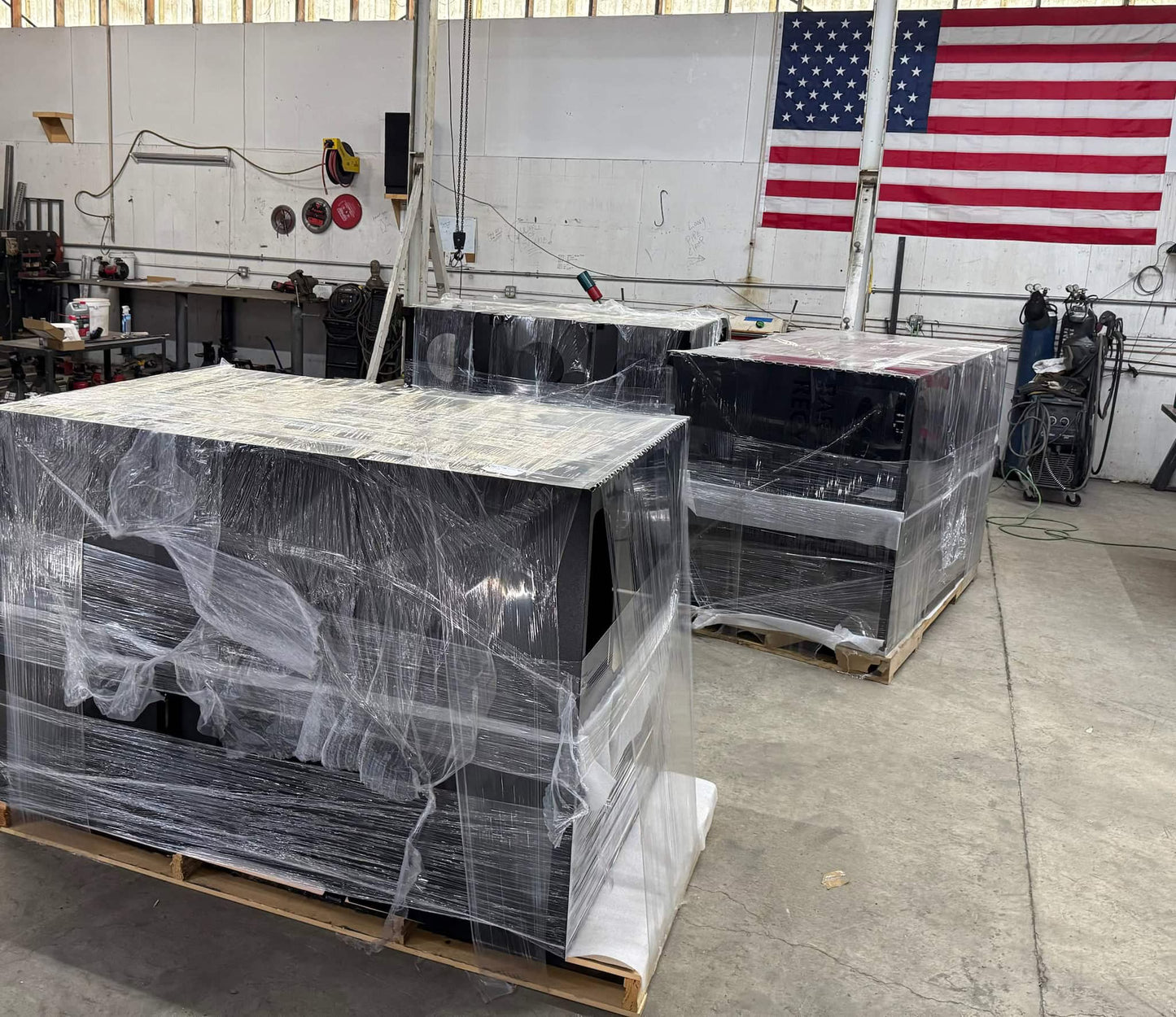 Custom trash and Recycling bins being packaged before shipping out to commercial customer from Gheer Built fab shop.