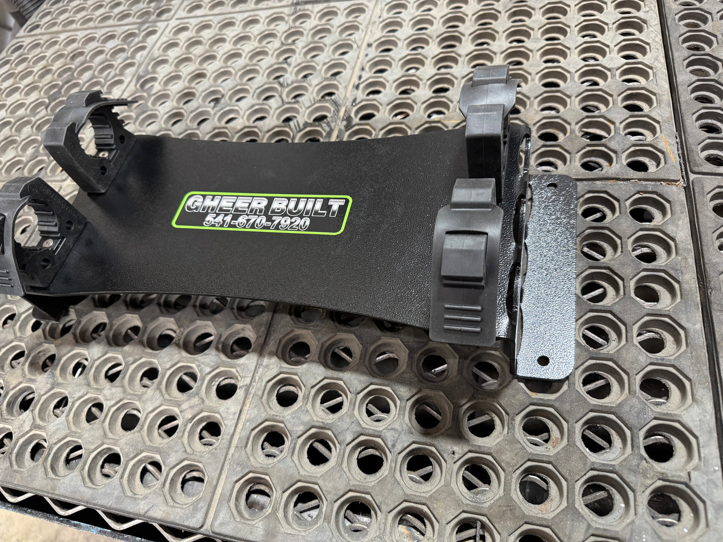 Closeup of flat mount tool holder that shows its steel build and quick release.