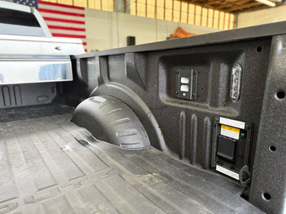 Removable factory rear-right tie-down bracket on Ford truck