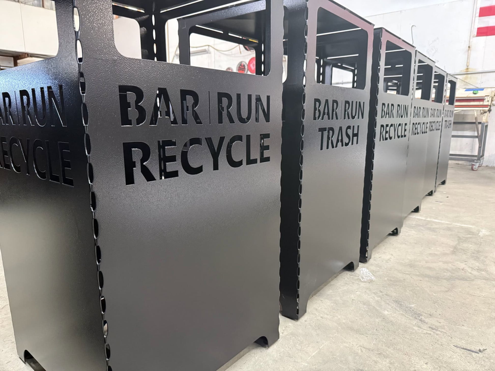 metal custom recycling bin in metal fab shop.