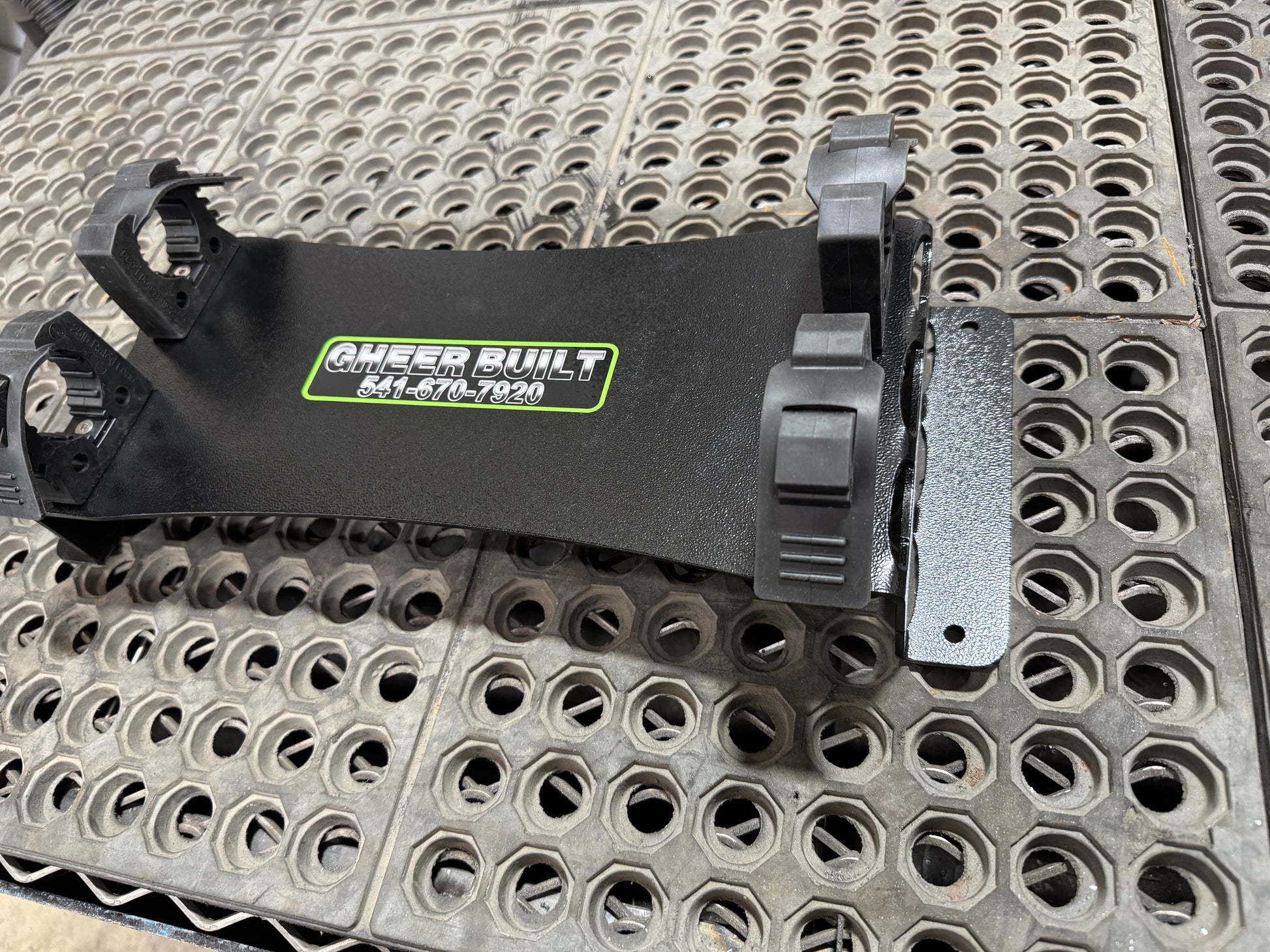Closeup of flat mount tool holder that shows its steel build and quick release.